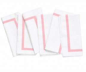 Elegant cloth dinner napkin in white with a colorful border, styled for a refined and coordinated tablescape.