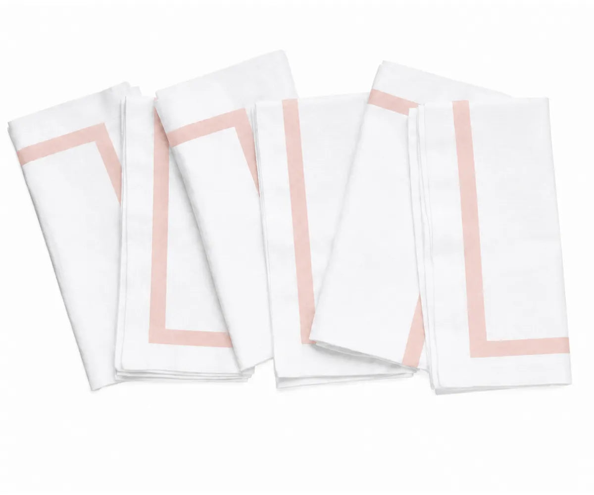 white cotton napkin showcasing its clean border finish and smooth woven fabric texture.