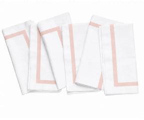 white cotton napkin showcasing its clean border finish and smooth woven fabric texture.