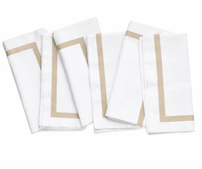 Set of soft 100% cotton cloth napkins in white, designed for reusable everyday dining and entertaining.