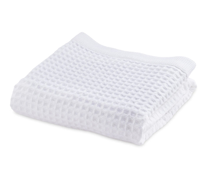 white cotton waffle bath towel folded 30x60 inches soft absorbent quick dry spa towel
