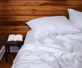 white linen sheet set on bed – includes fitted sheet, flat sheet, and pillowcases in king, queen, and twin sizes