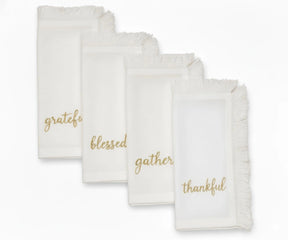 White cotton fringe napkins with gold embroidered words – Grateful, Blessed, Gather, Thankful
