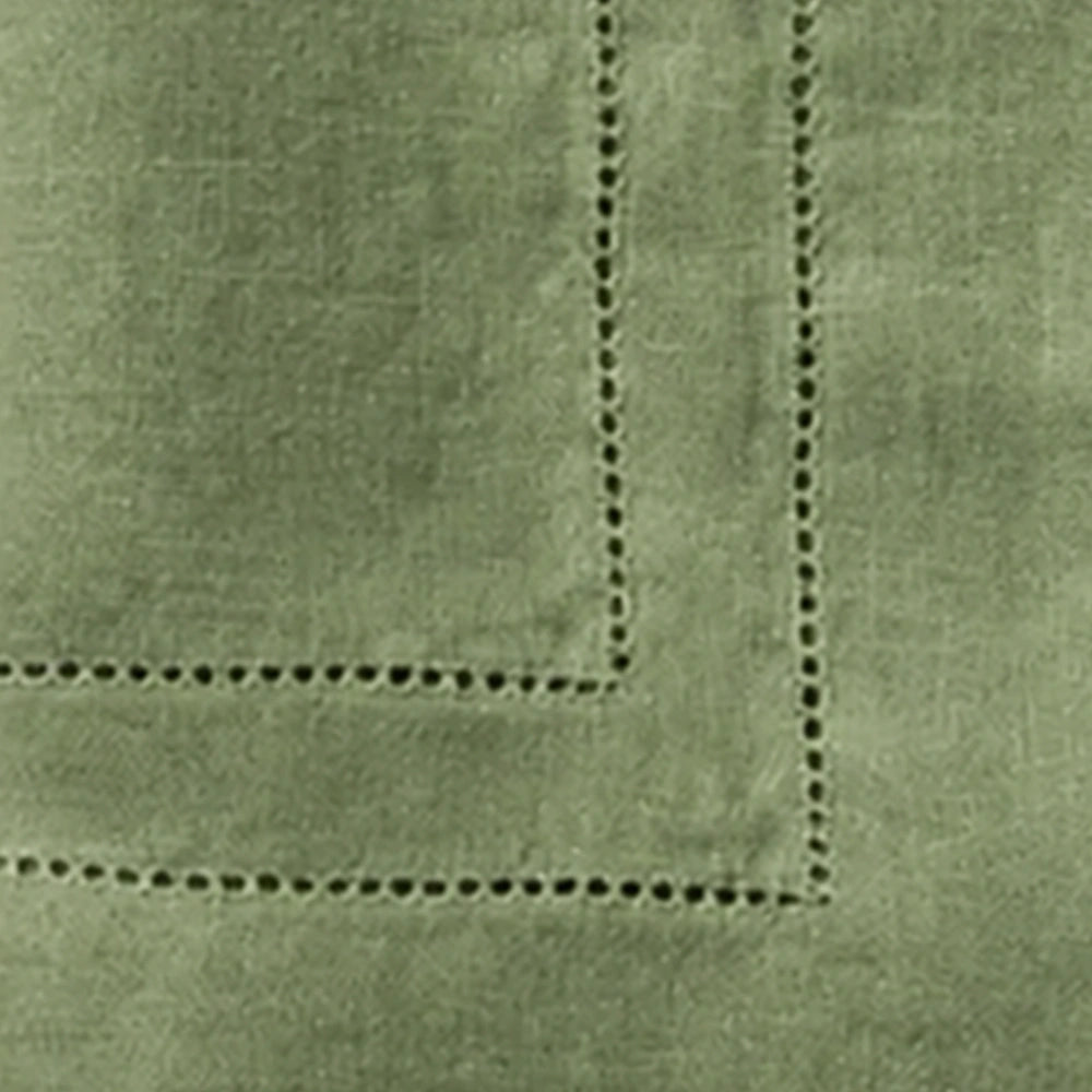 Close-up of Willow Green linen cloth napkins featuring premium 100% linen fabric and classic double hemstitch border for luxury table décor.