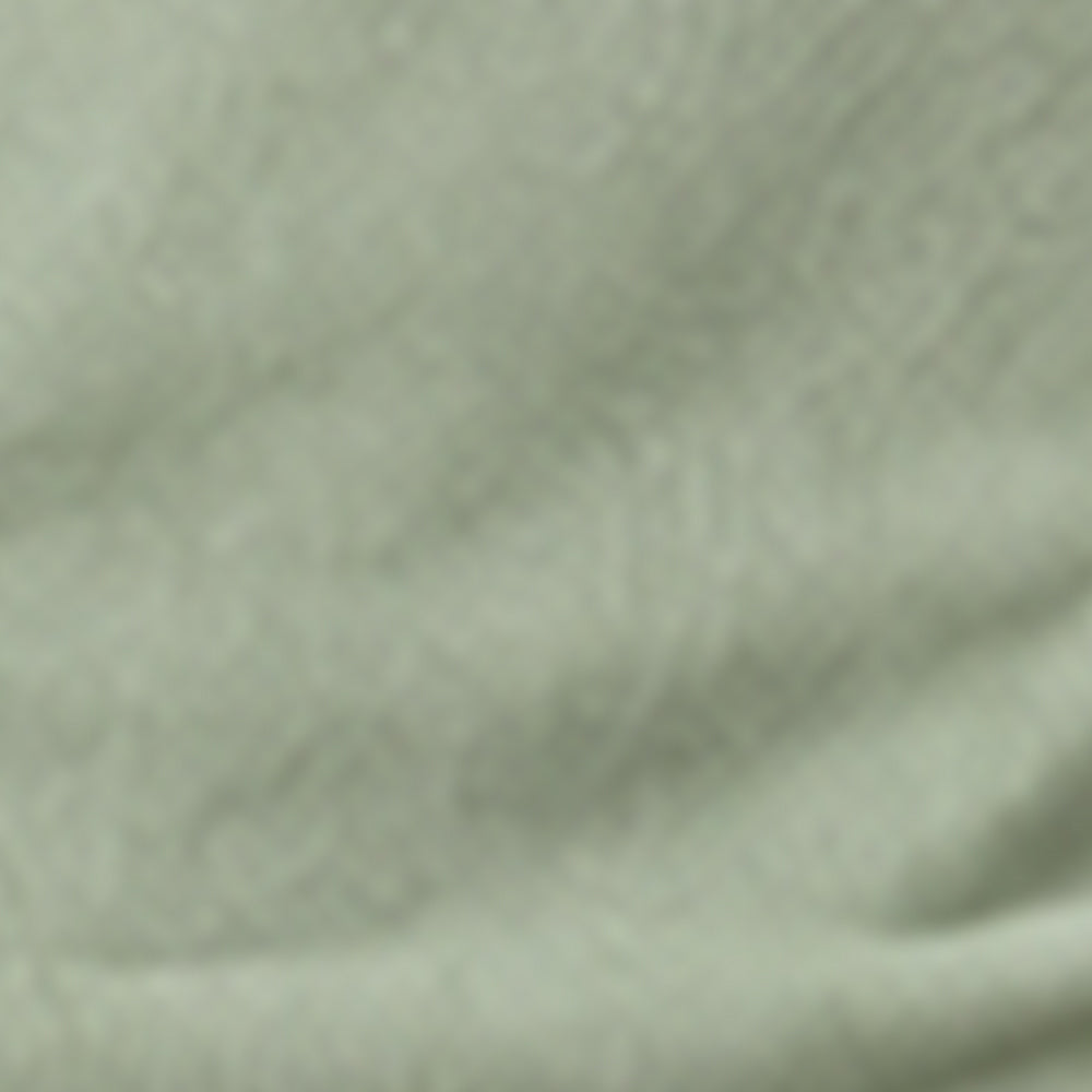 Fabric swatch showing sage green ribbed cotton material