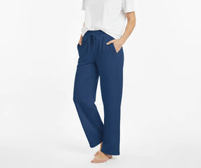 Women’s loose-fit blue cotton pants with airy, breathable 100% cotton for all-day comfort.