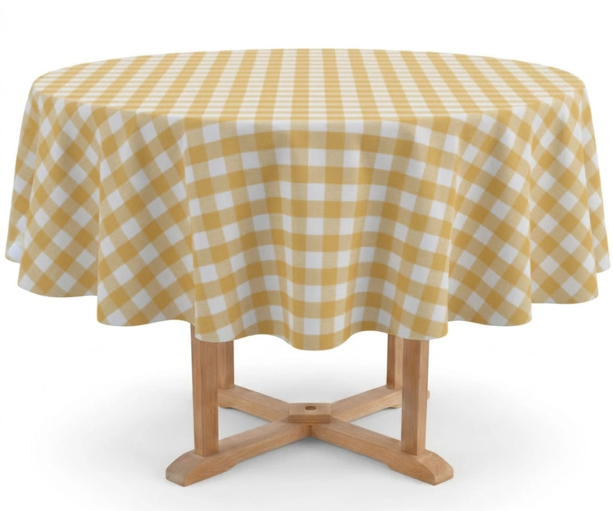 A round table covered with a yellow and white gingham checkered tablecloth, shown on a light wood pedestal against a plain white background.