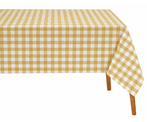 Yellow checked tablecloth styled with white dinnerware and natural woven placemats. 
