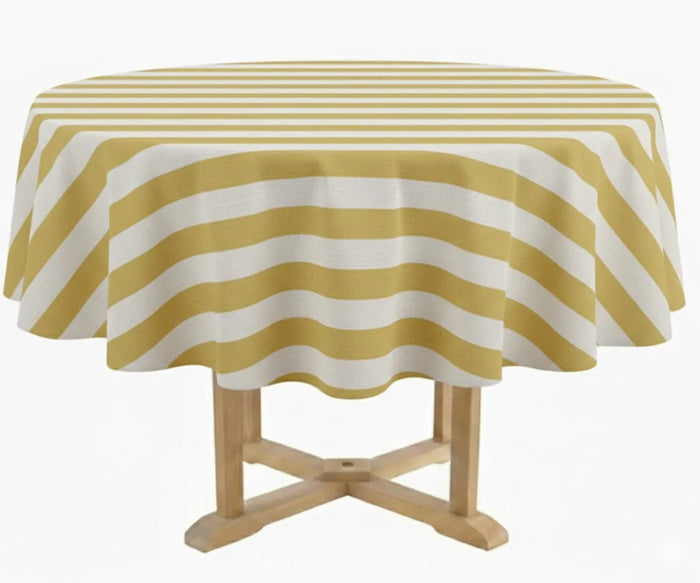 60 inch striped round tablecloth in classic cabana design featuring sage yellow and white vertical stripes, styled on a round dining table with coordinated dinner napkins. Made from 100% cotton, this farmhouse-inspired round table linen is suitable for indoor dining, patio gatherings, outdoor entertaining, and wedding table settings with a clean coastal aesthetic.
