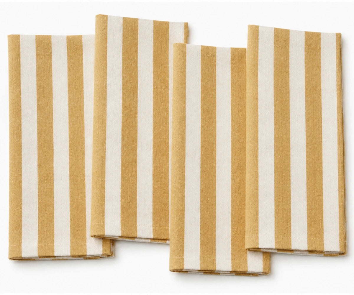 Yellow striped cloth napkins crafted from 100% cotton, adding a fresh decorative touch while providing softness and absorbency for everyday use.