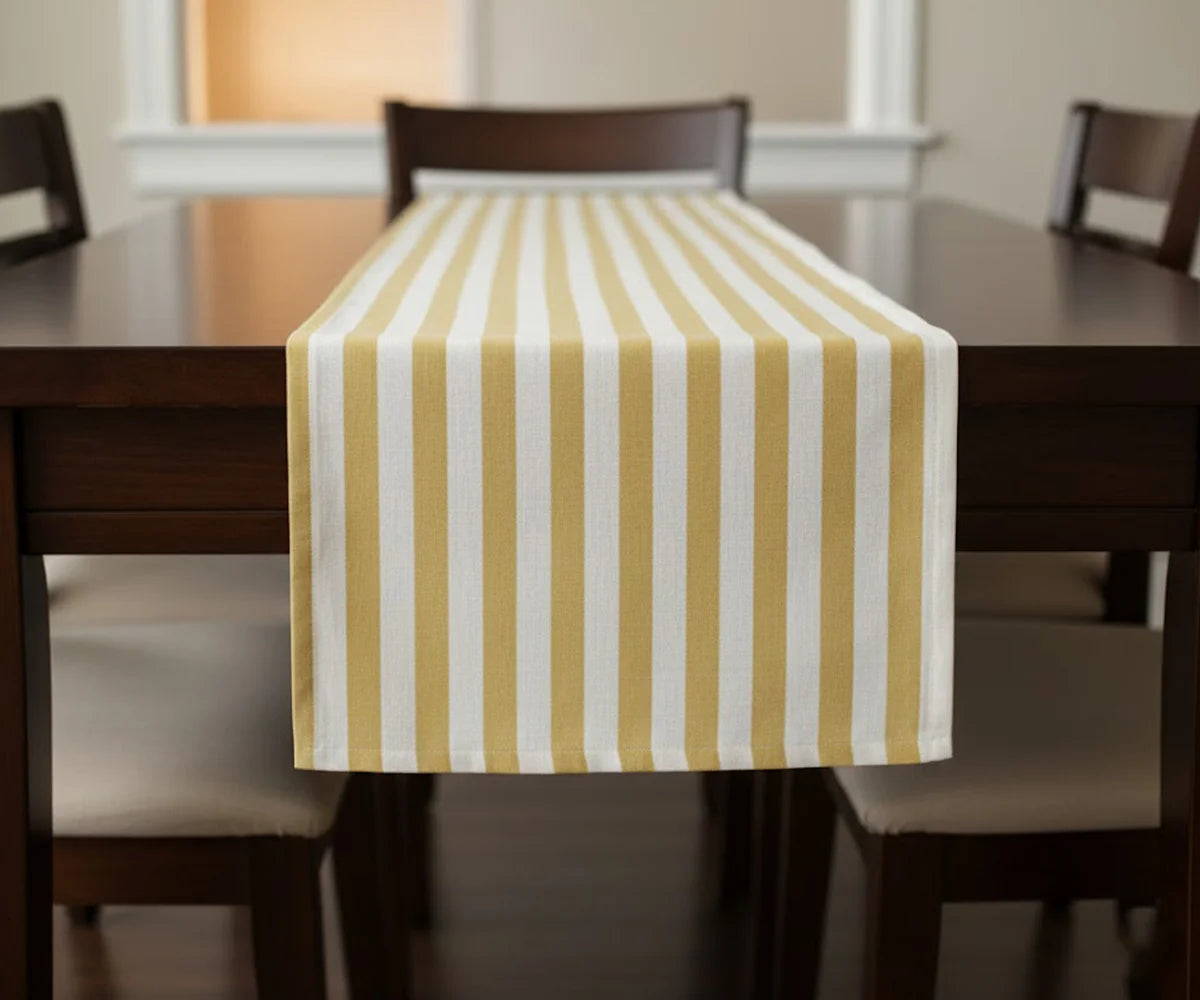 Yellow and white striped cotton table runner on dining table