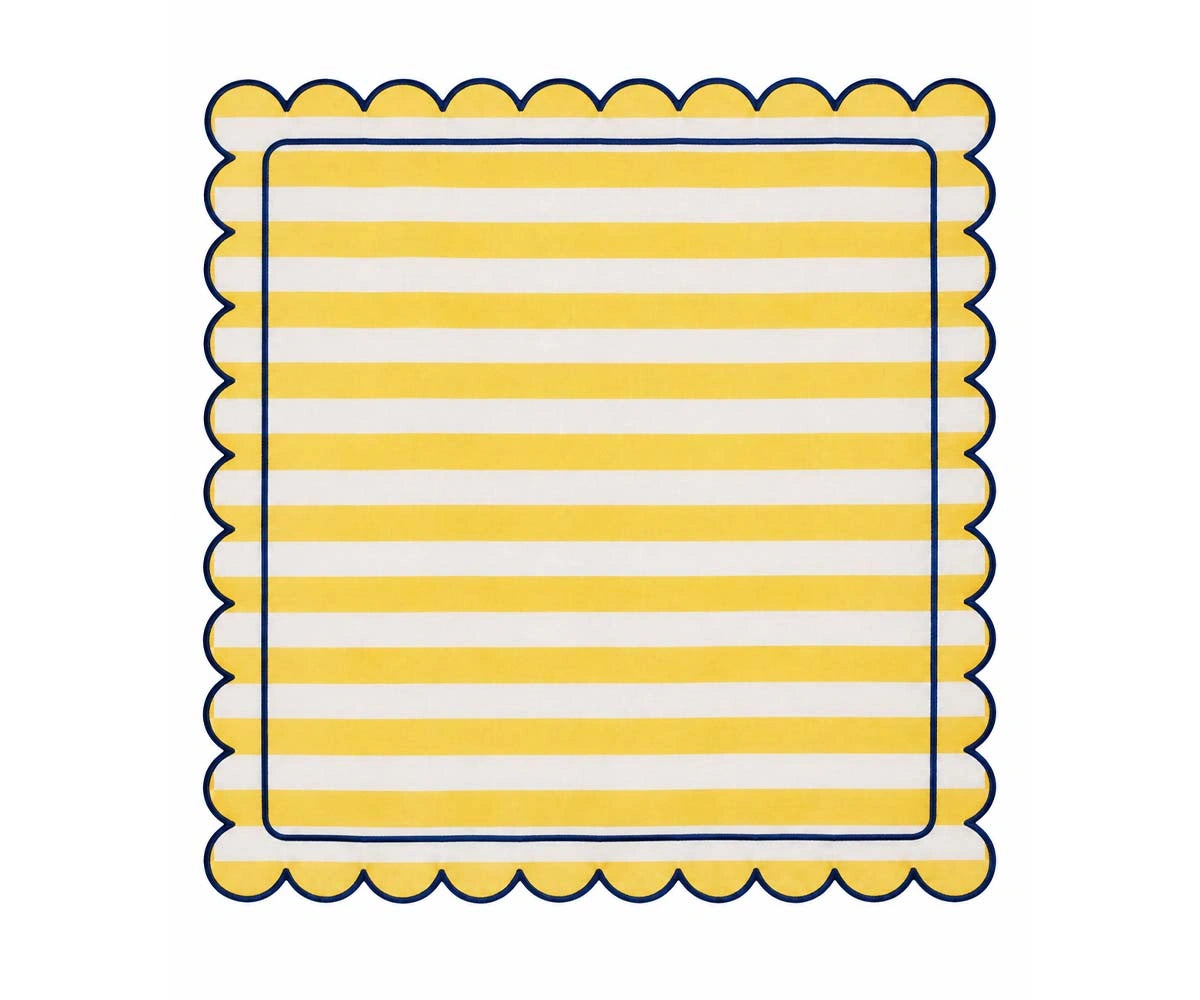 Yellow and white striped cloth napkin with scalloped edges and navy trim for cheerful dining table decor