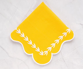 Yellow scalloped cotton napkins styled with a matching yellow tablecloth, bright and elegant napkins for family dining and entertaining