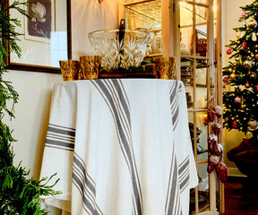 Outdoor tablecloth on a table with Christmas tree decorations