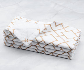 Copper napkins- white cloth napkins set of 4 copper Foil napkins are  are arranged one above another.