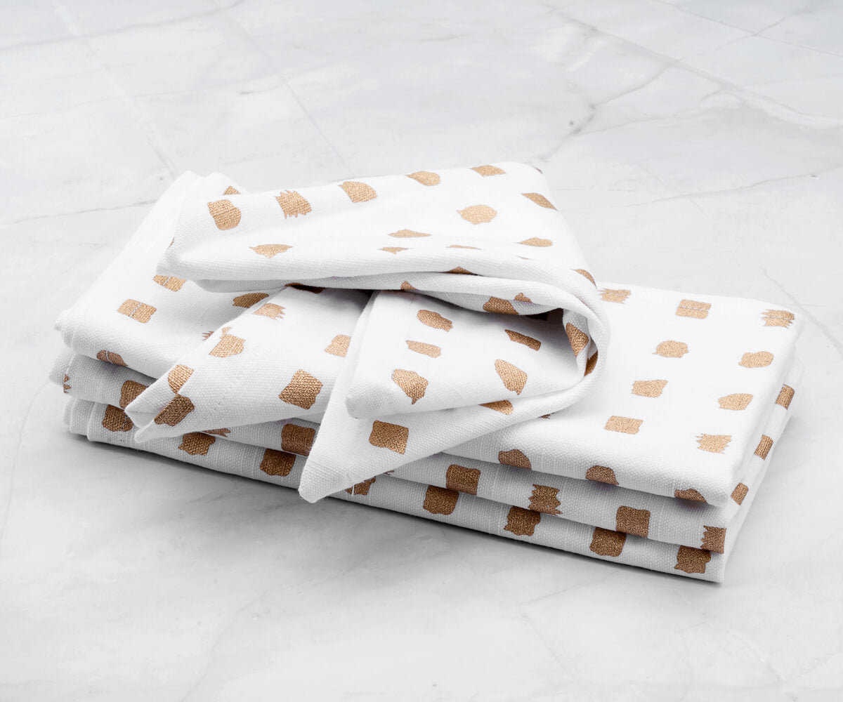 Set of 4 printed napkins-Metallic linen napkins are placed in white background (Printed napkins - White napkins)