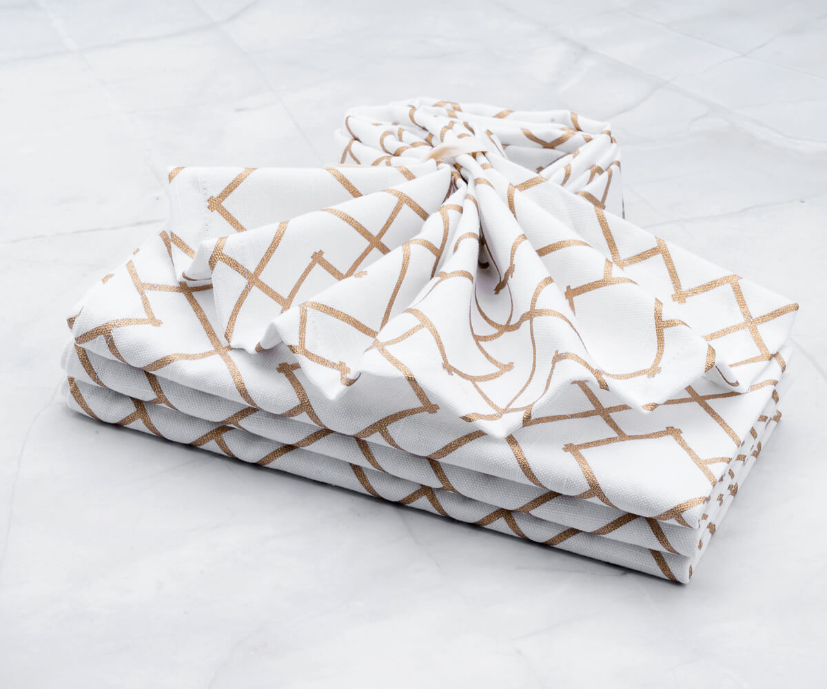 Folded gold napkins- Cotton napkins are arranged one in white background. Metallic cloth napkins, Wedding cocktail napkins, Linen napkins.