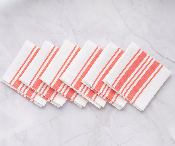 Six restaurant napkins with red and white stripes displayed