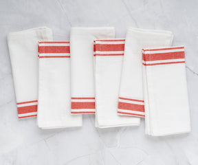 Set of 6 restaurant napkins with orange stripes displayed
