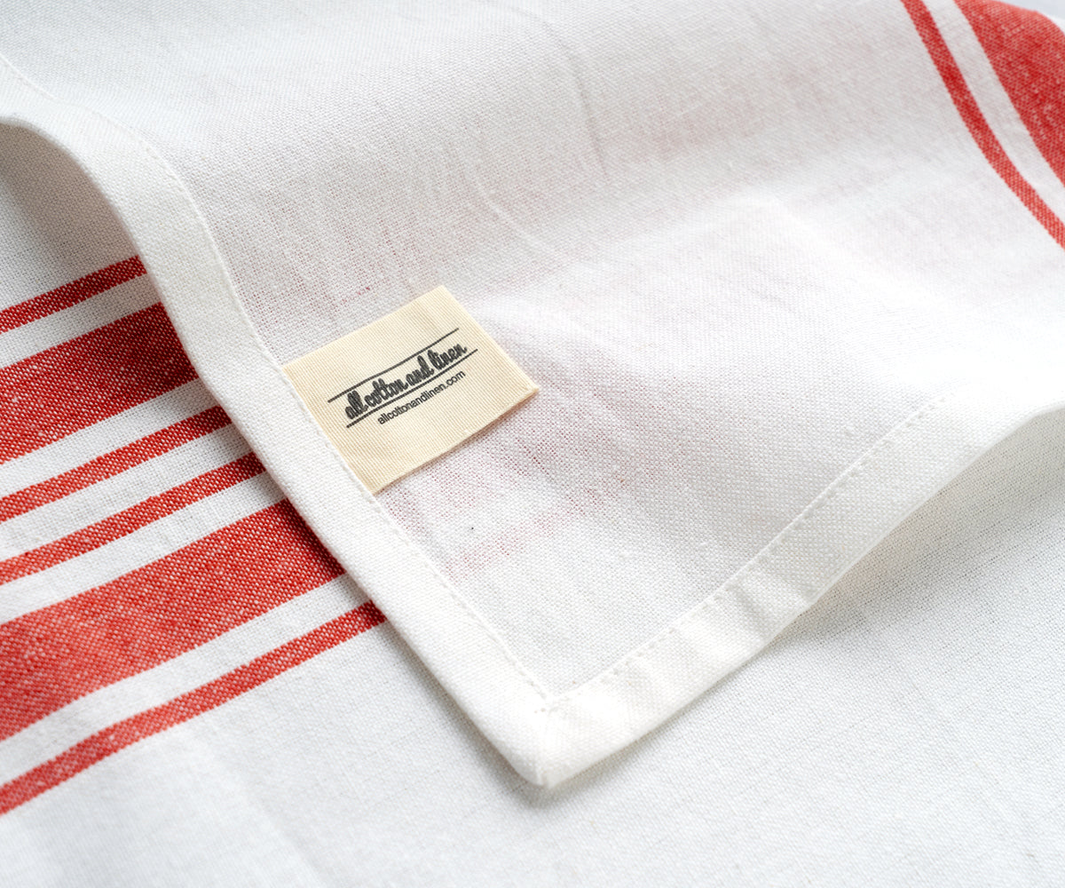 White restaurant napkin featuring red stripes