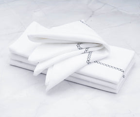 Their embroidery cloth napkins complement a wide range of table linens and dinnerware.
