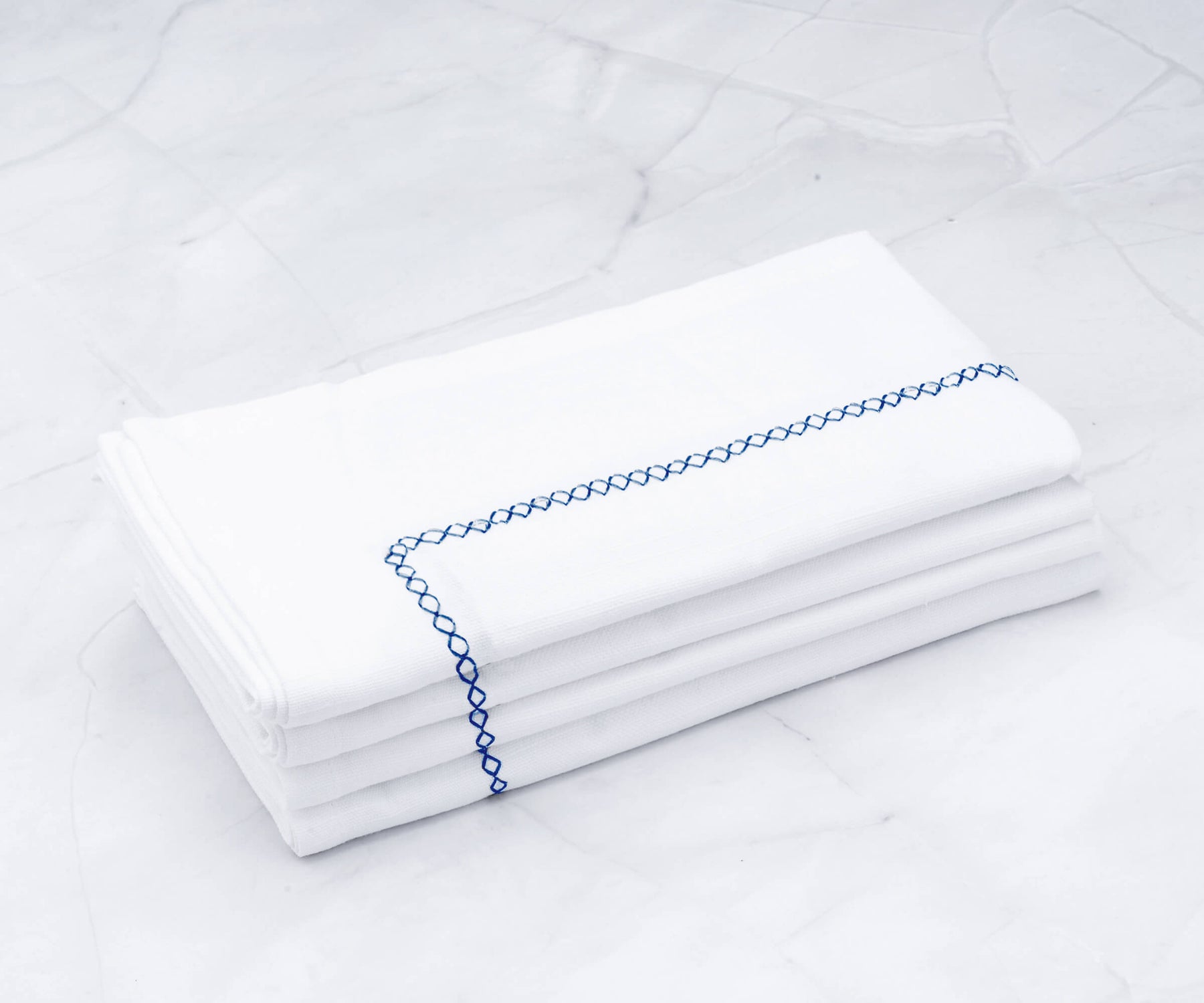 Folded Dinner Napkins come in a variety of designs, ranging from delicate floral patterns