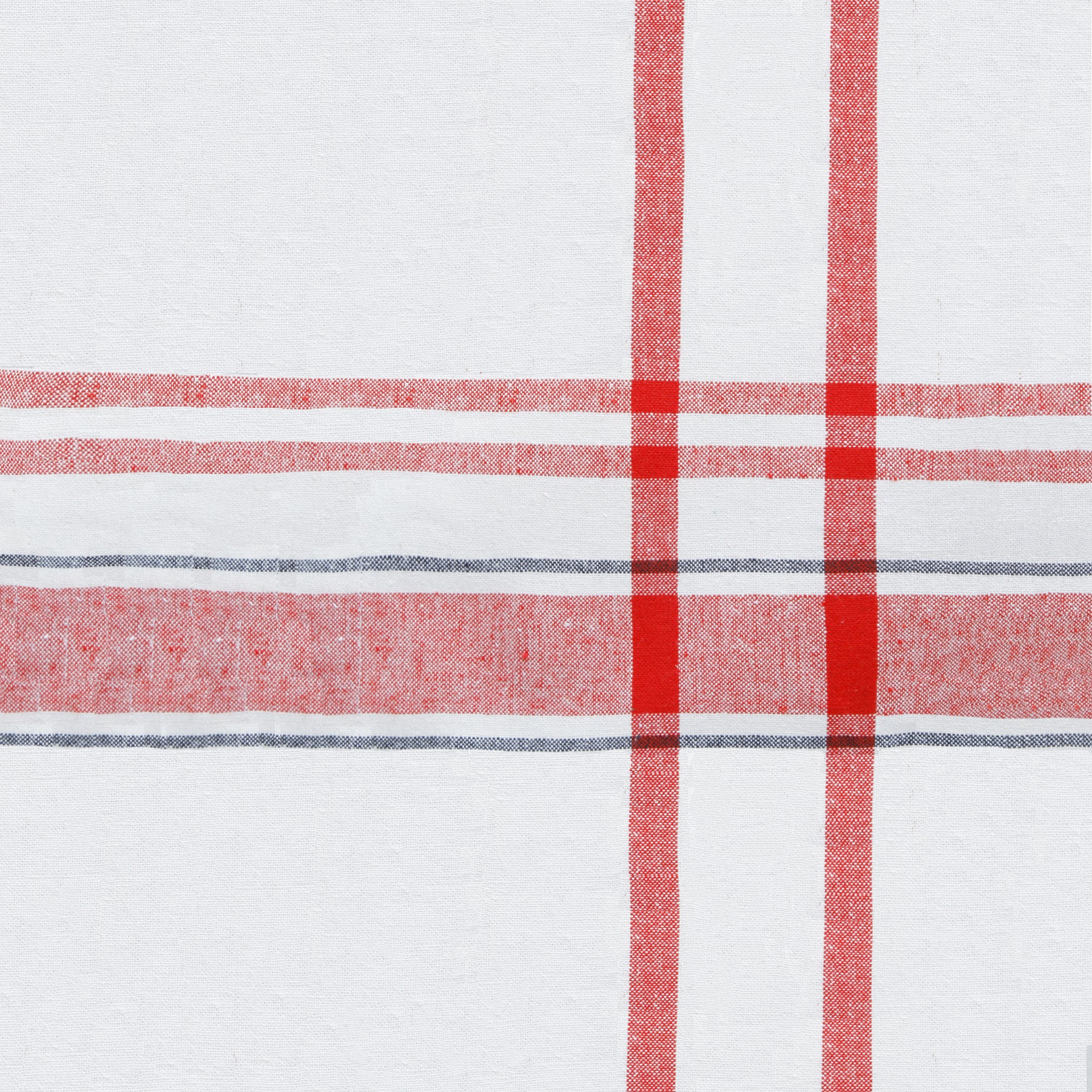 French tablecloth in red and white checkered pattern on a white background