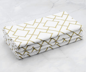 Folded set of 4 Cotton napkins - gold dinner napkins  are arranged one above another.(cloth dinner napkins)