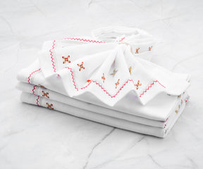 White dinner napkins with a monogrammed initial, personalized for a special dinner event.