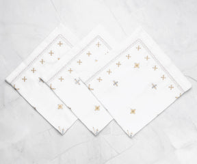 Some white dinner napkins are made from sustainable materials and are biodegradable, reducing environmental impact.