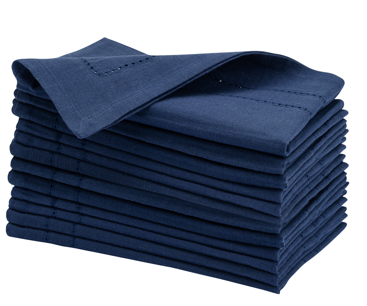 Crisp stack of Navy blue Cloth Dinner Napkins presented on a pure white backdrop.
