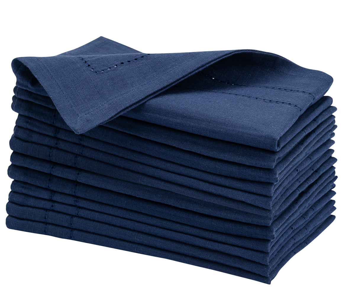 Crisp stack of blue Cloth Dinner Napkins presented on a pure white backdrop