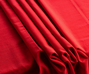 "Add warmth with red, elevate with fabric textures, and celebrate Christmas with our diverse tablecloth collection."