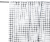 Black grid linen curtain panel, light-filtering, styled in a modern living room