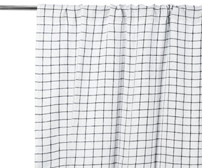 Black grid linen curtain panel, light-filtering, styled in a modern living room