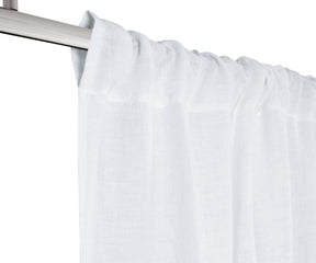 White 100% linen curtain panel, light-filtering, styled in a bright living room
