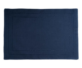 A rectangular placemats of size 13×18",The hem stitched navy blue table placemats are arranged in white background.