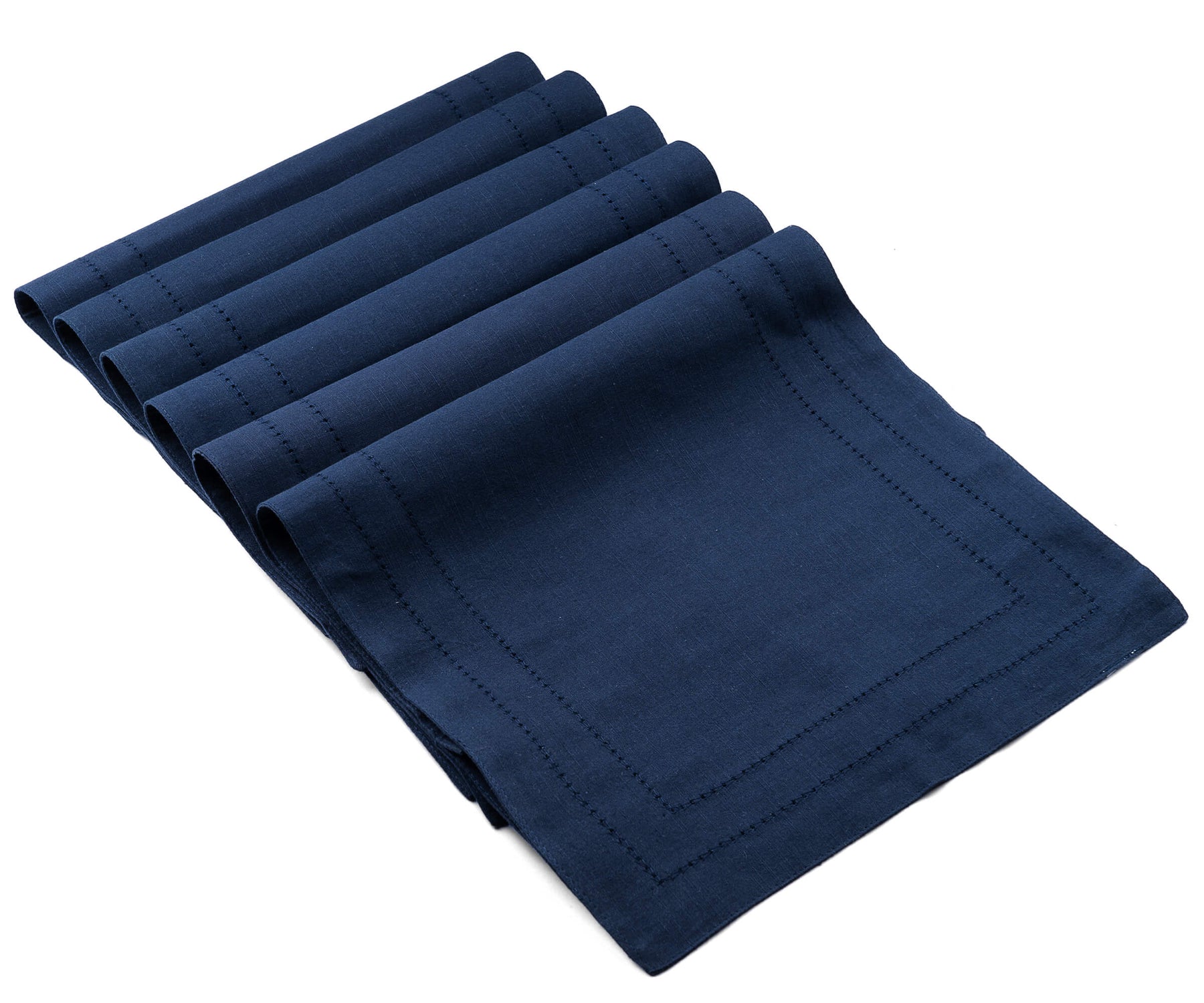 Folded rectangular placemats of size 13×18",a set of 6 hem stitched navy blue woven placemats are arranged one above another.