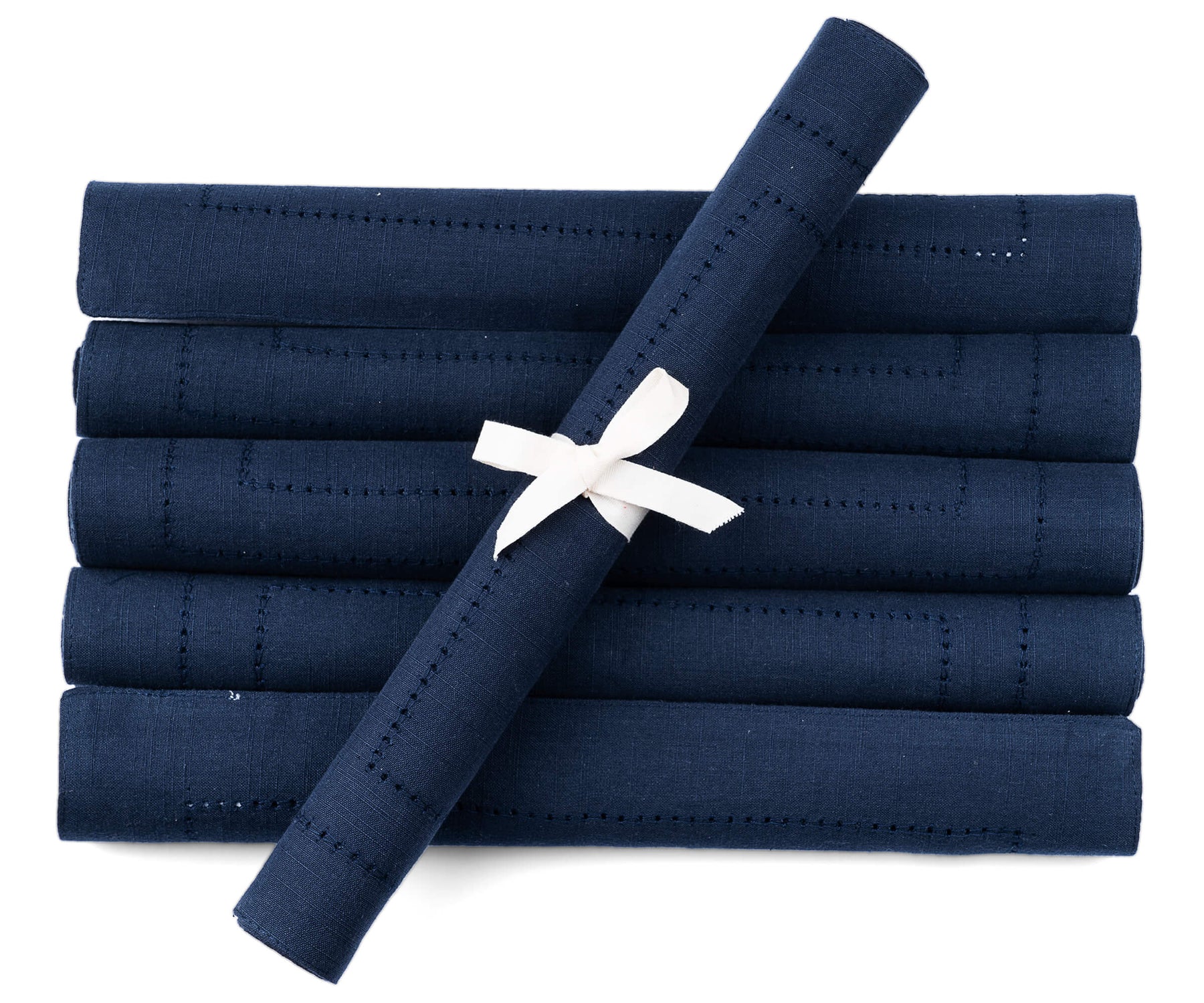 Rolled rectangular placemats of size 13×18",a set of 6 hem stitched navy blue table placemats are arranged in white background.