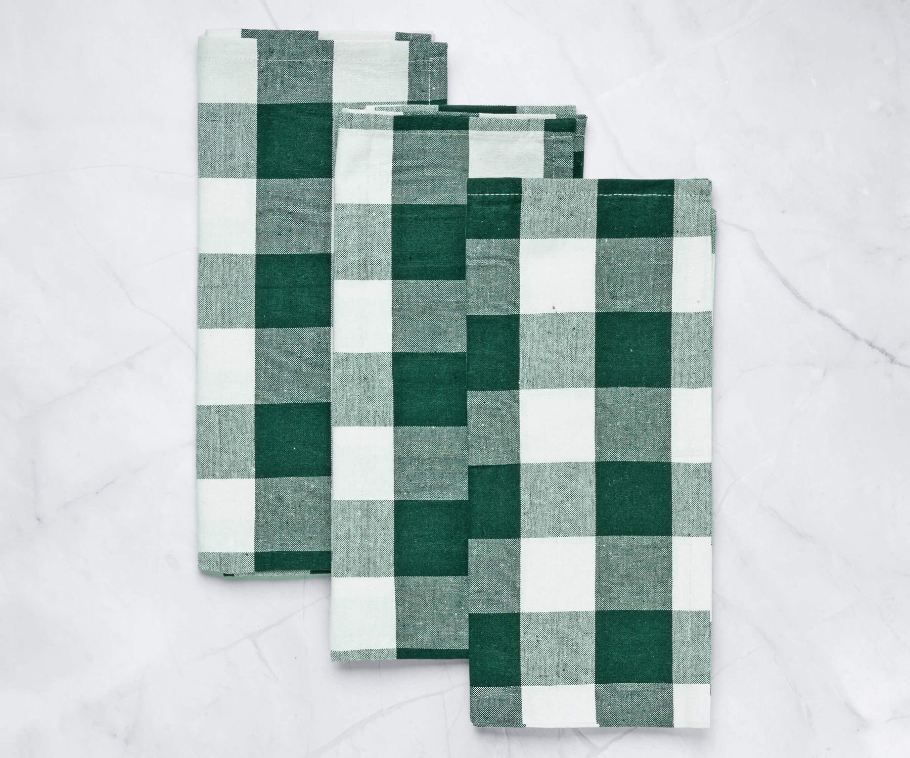These green waffle weave kitchen towels are a versatile and absorbent choice for drying dishes, wiping counters, or cleaning up spills.