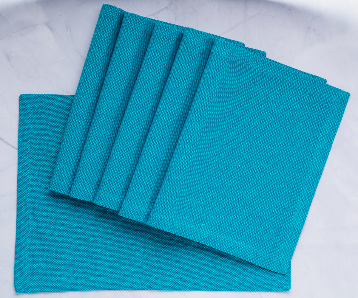 Elevate your table decor with stylish blue pattern placemats, showcasing a trendy buffalo plaid design for a chic and practical dining upgrade