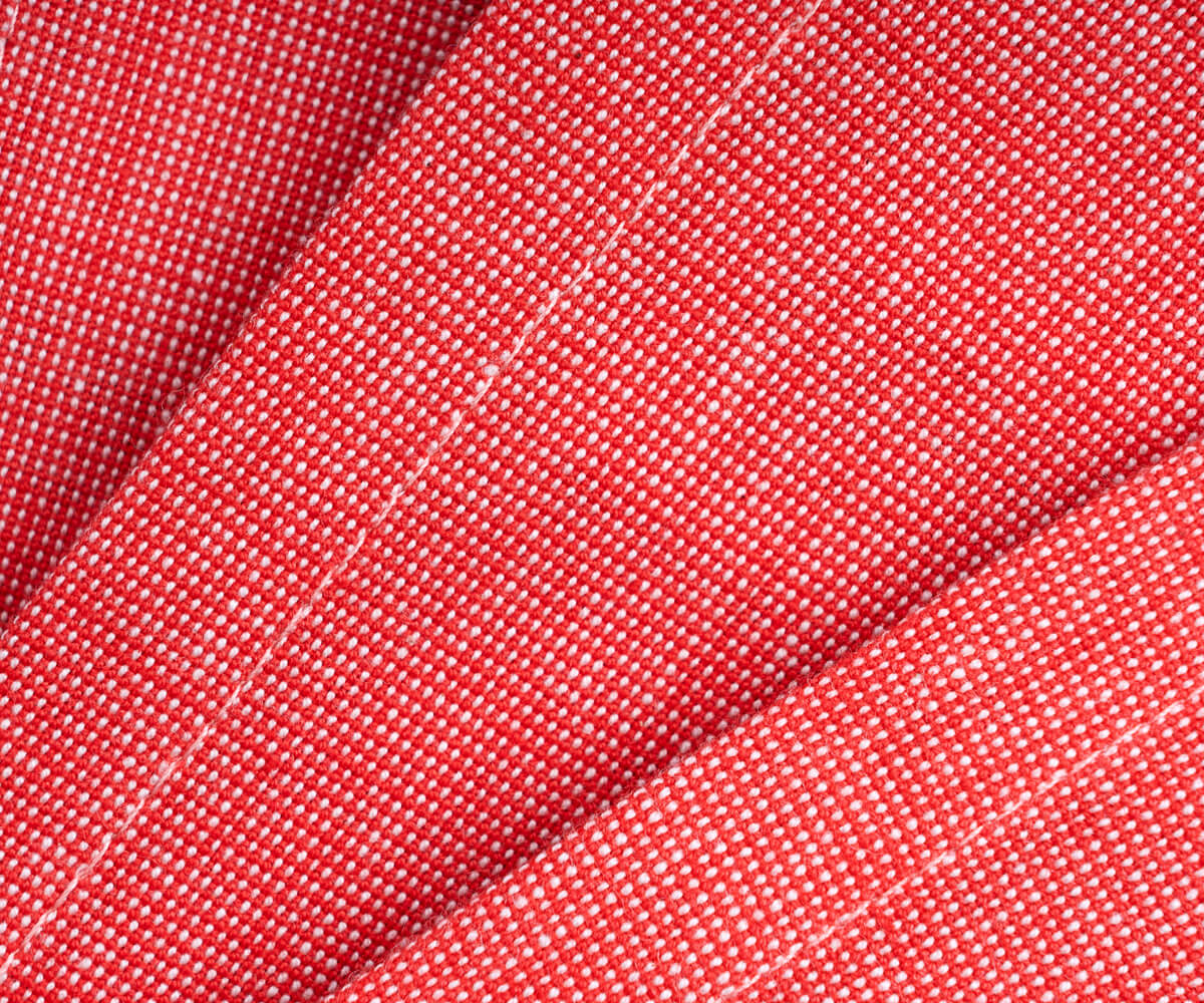 The back side of the red orange dinner cloth napkins.