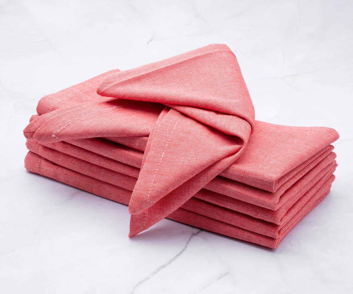 Red orange cloth napkins of size 20×20", linen napkins set of 6 are arranged one above another.