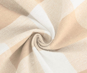 Beige round tablecloth with white checkered pattern