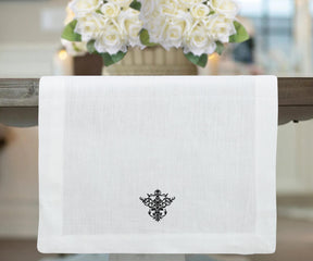 white table runner with black embroidery design and hemstitched table runner. black table runner