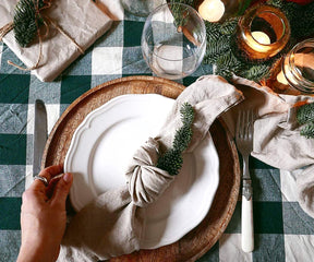 A black tablecloth demands careful consideration of lighting to prevent the setting from appearing too dark and to maintain visual impact.