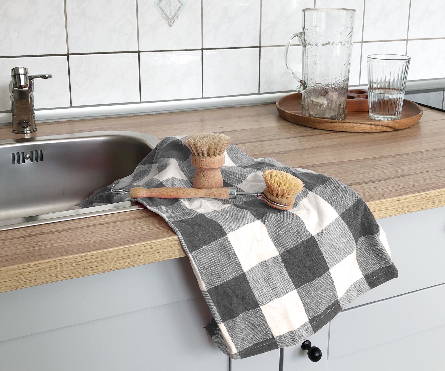 These grey waffle weave kitchen towels are a versatile and absorbent choice for drying dishes, wiping counters, or cleaning up spills.