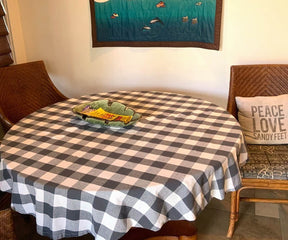 Round table with a black and white checkered design and place settings