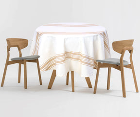 Personalize your dining space with a beige tablecloth, allowing you to express your unique style while providing a cozy backdrop for meals.