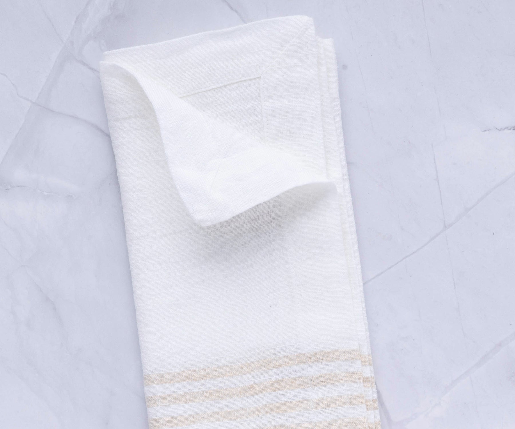 A single linen dinner napkin with a striped pattern
